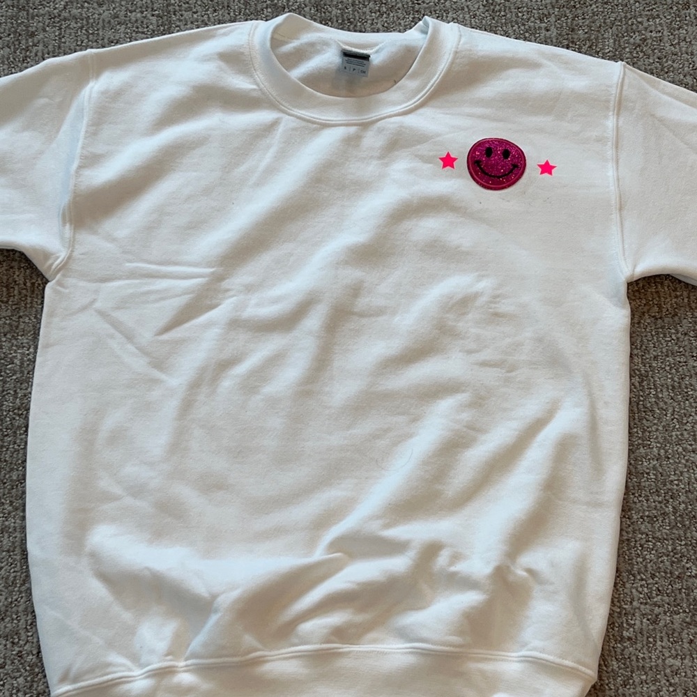 Selling a preppy smiley face crewneck
